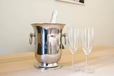a blender next to two wine glasses on a table at Art Deco 21 Luxury 2BR Apartment Downtown Metro AC in Porto