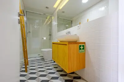 a bathroom with a sink and a toilet at Bonfim Garden Apartment Near Metro & City Center in Porto