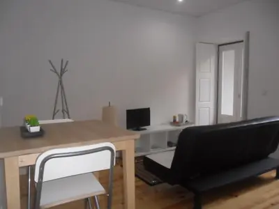 a dining room with a table and a chair at Your Place Porto II in Porto