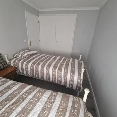 two beds in a small room with at Miragaia Charm Apartment in Porto