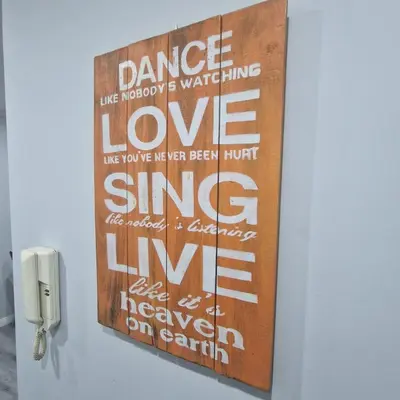 a sign that says dance like nobody is waitinglovelove sing sing live liveleaf at Miragaia Charm Apartment in Porto