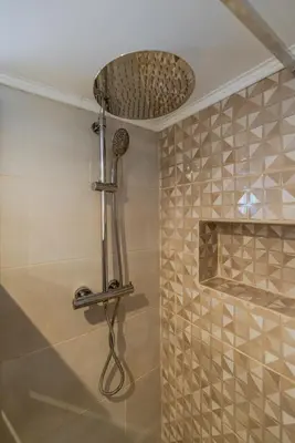 a bathroom with a shower with a shower head at Quinta do Vintém near WOW by HostWise in Vila Nova de Gaia