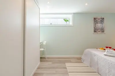 a white room with a bed and a window at Quinta do Vintém near WOW by HostWise in Vila Nova de Gaia