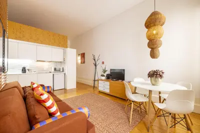 a living room with a couch and a table at Porto Ribeira Flat in Porto