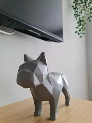 a metal sculpture of a cat on a table at Campanhã - Studio A in Porto