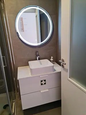 a bathroom with a sink and a mirror at Campanhã - Studio A in Porto