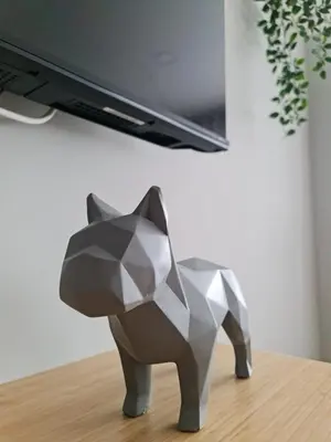 a paper cat statue sitting on top of a table at Campanhã - Studio A in Porto
