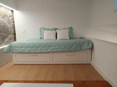 a bed with two pillows on it in a room at Original Porto - Cedofeita in Porto