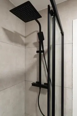 a shower with a shower head in a bathroom at HostWise - Modern Flat in Boavista in Porto