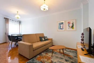 a living room with a couch and a table at Aposentus - Antas Heaven in Porto