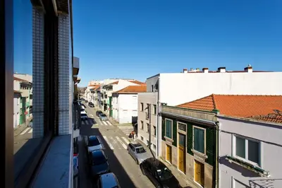 a view of a city street with parked cars at Aposentus - Antas Heaven in Porto