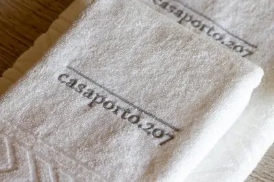 a white napkin with the word caladium on it at Central charming flat SÉ by casaporto207 in Porto