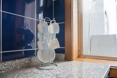 a group of hair clippers hanging on a wall at Aposentus - Cest La Vie in Porto