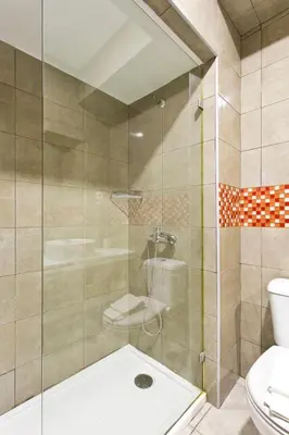 a bathroom with a shower and a toilet at APOSENTUS - Serenity 2E in Porto