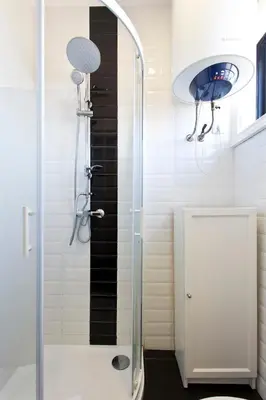 a shower with a glass door in a bathroom at APOSENTUS - The First in Porto