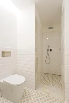 a white bathroom with a toilet and a shower at Aposentus - Formosa Boutique in Porto