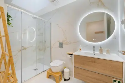a bathroom with a shower and a toilet and a sink at GuestReady - A lovely stay in Rua da Boavista in Porto