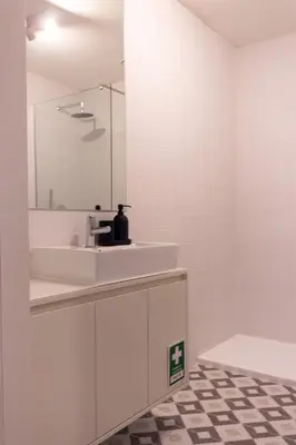 a bathroom with a sink and a mirror at ORM - Cedofeita II Apartment in Porto