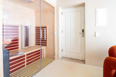 a room with a glass door leading to a bedroom at Miguel Bombarda House in Porto