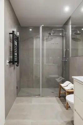 a shower with a glass door in a bathroom at Oporto City View - Ferreira Cardoso in Porto