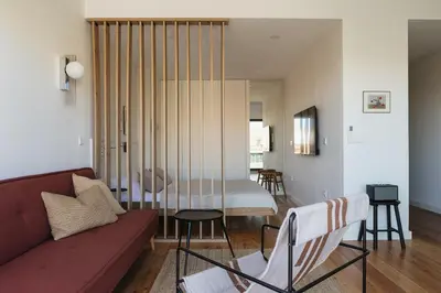 a living room with a couch and a table at Oporto City View - Ferreira Cardoso in Porto