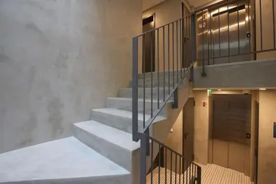 a staircase in a building with a stair case at FLH Porto Central Apartments in Porto