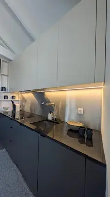 a kitchen with a sink and a counter top at Castelo River View - NEW in Vila Nova de Gaia