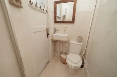 a small bathroom with a toilet and a sink at Downtown Retro Bolhao by Vacationy in Porto