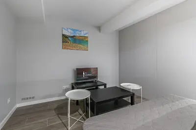 a bedroom with a bed and a table and chairs at GuestReady - Olivieri's House in Porto