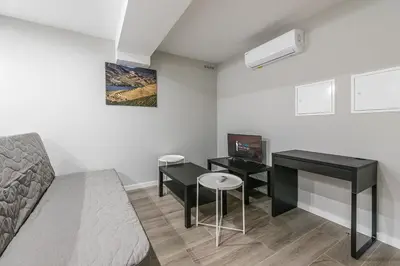 a room with a couch and a table and a desk at GuestReady - Olivieri's House in Porto