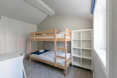a bedroom with bunk beds in a room at GuestReady - Olivieri's House in Porto