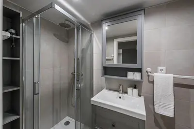 a bathroom with a shower and a sink and a mirror at GuestReady - Olivieri's House in Porto