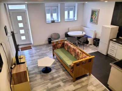 a living room with a couch and a table at Casa Pedro Hispano 3B in Porto