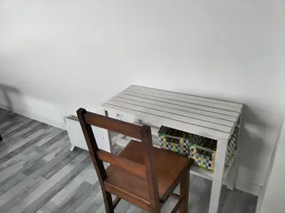 a wooden table with a wooden chair next to a desk at Casa Pedro Hispano 3B in Porto