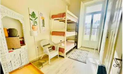 a room with two bunk beds and a mirror at aiPorto downtown, family&friends 2! in Porto