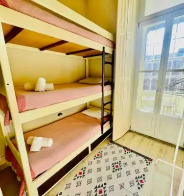 a bedroom with a large bed with two pillows at aiPorto downtown, family&friends 2! in Porto
