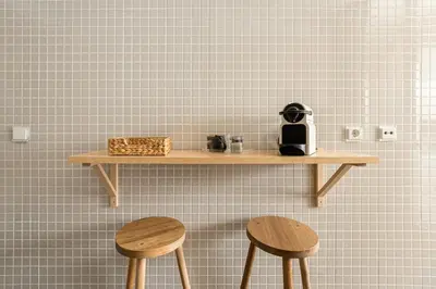 a shelf on a wall with two wooden stools at GuestReady - Cityscape residence with balcony in Porto
