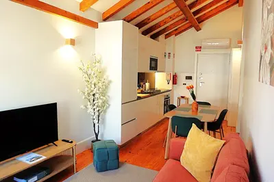 a living room with a red couch and a table at PORTO SWEETHEART - Ricardo Jorge in Porto