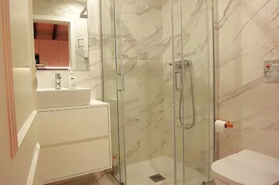a bathroom with a shower with a toilet and a sink at PORTO SWEETHEART - Ricardo Jorge in Porto