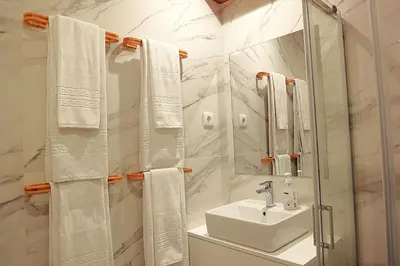 a white bathroom with a sink and a mirror at PORTO SWEETHEART - Ricardo Jorge in Porto