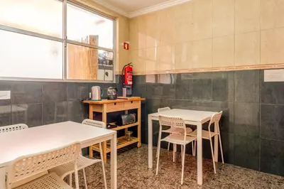 a dining room with two tables and chairs at Petit Suites by PCALE in Porto