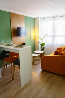 a living room with a table and a couch at Green Universe Porto by MyMoradia in Porto