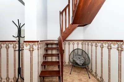 a staircase in a room with a stair case at Gaia Family Nest in Vila Nova de Gaia