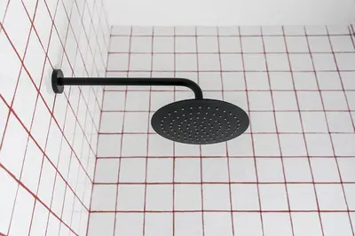 a shower head on a tiled wall at GuestReady - Joy Apartments in Porto