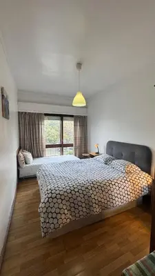 a bedroom with a large bed and a window at Covelo in Porto