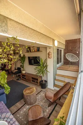 a living room filled with furniture and a tv at Amy's Place in Porto