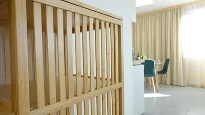 a wooden partition in a room with a table at Ryamen Inn B in Porto
