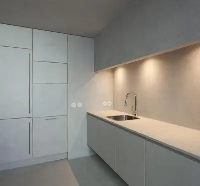 a kitchen with white cabinets and a sink at Santa Catarina 555 T4 in Porto