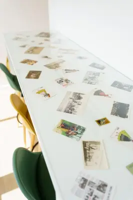 a white table with pictures on it at Lighthouse by MyMoradia I Vue & Élégance à Porto in Porto