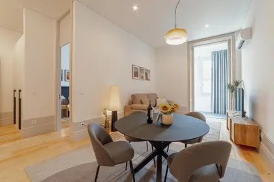 a living room with a table and chairs at Heart of Porto Apartments by Vacationy in Porto